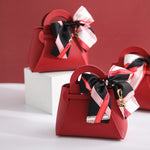 Load image into Gallery viewer, 20PCS Leather Gift Bags Bow Ribbon Packaging Bag Wedding Favour Distributions Bags Eid Mubarak Candy Packaging Box Mini Handbag
